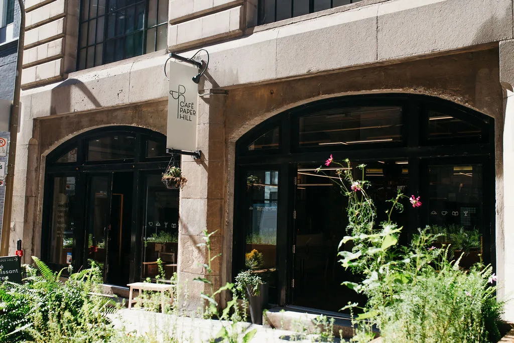 The heritage storefront and Paper Hill sign at Café Paper Hill