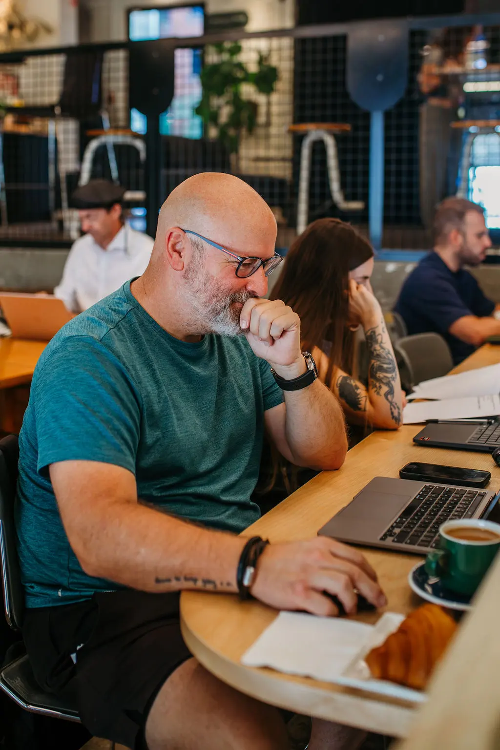 Guests working and reading inside Café Paper Hill