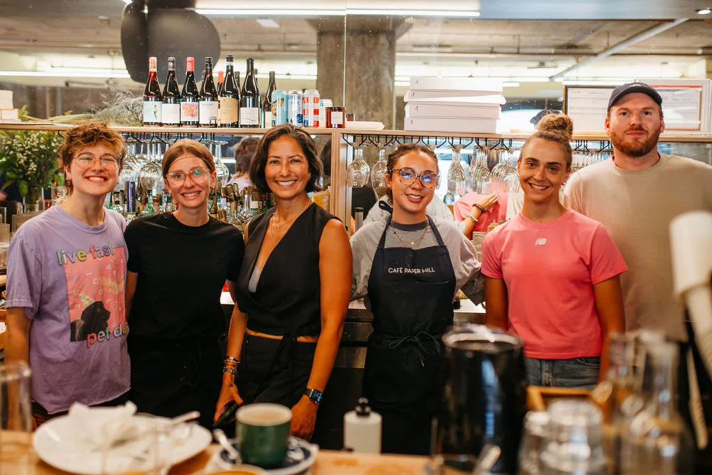 Selma Gueddich with the Café Paper Hill team behind the counter